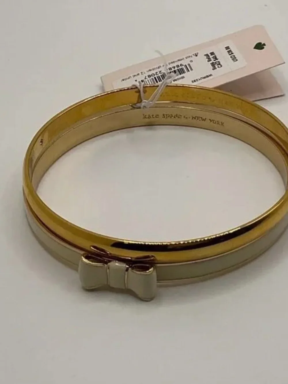 Kate Spade New York TAKE A BOW Gold & Cream/Idiom Gold-Tone Bangle Bracelet - Picture 2 of 9